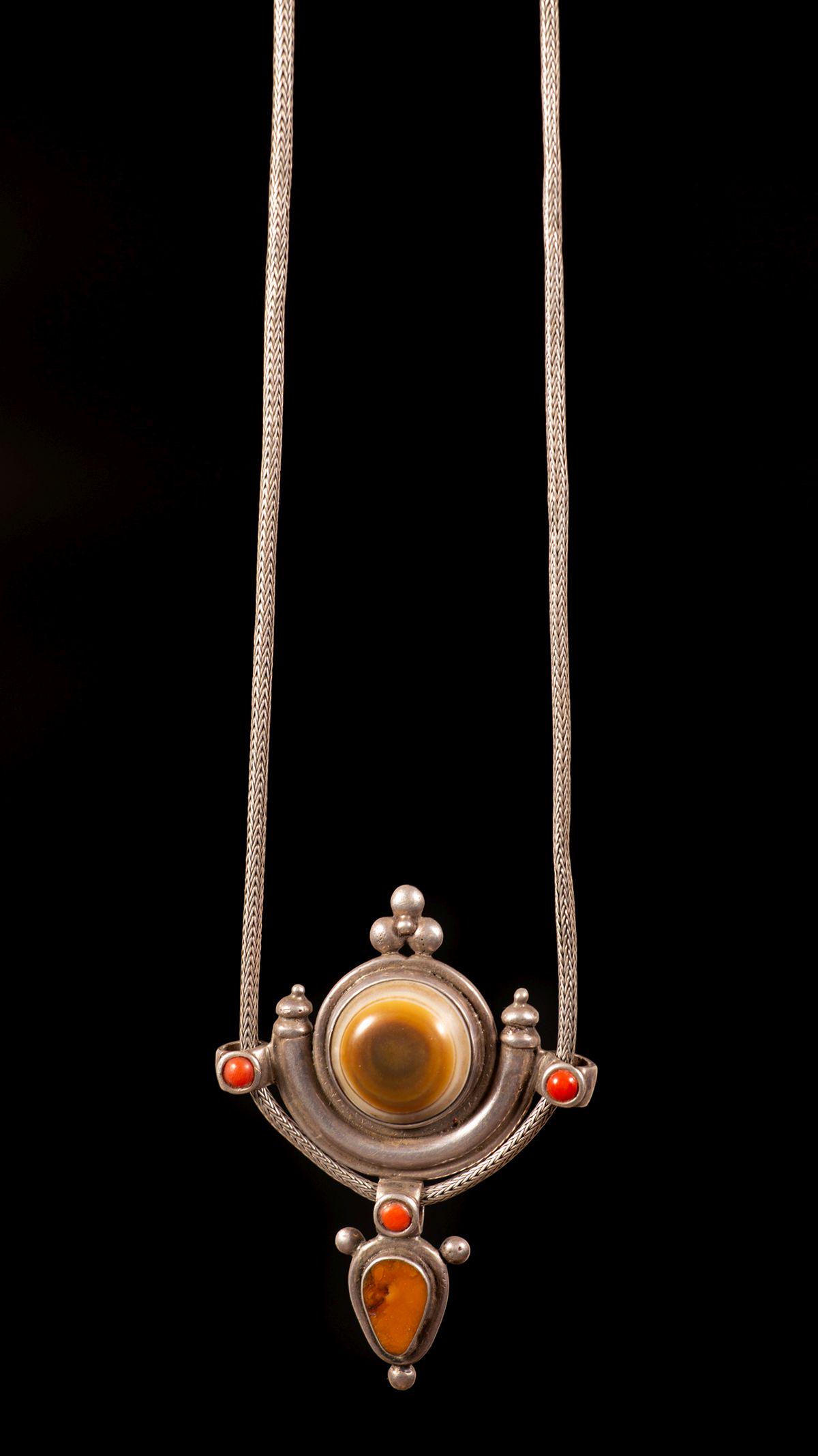 A silver Agate, amber and coral pendant - Nepal, 20th (1 of 3)