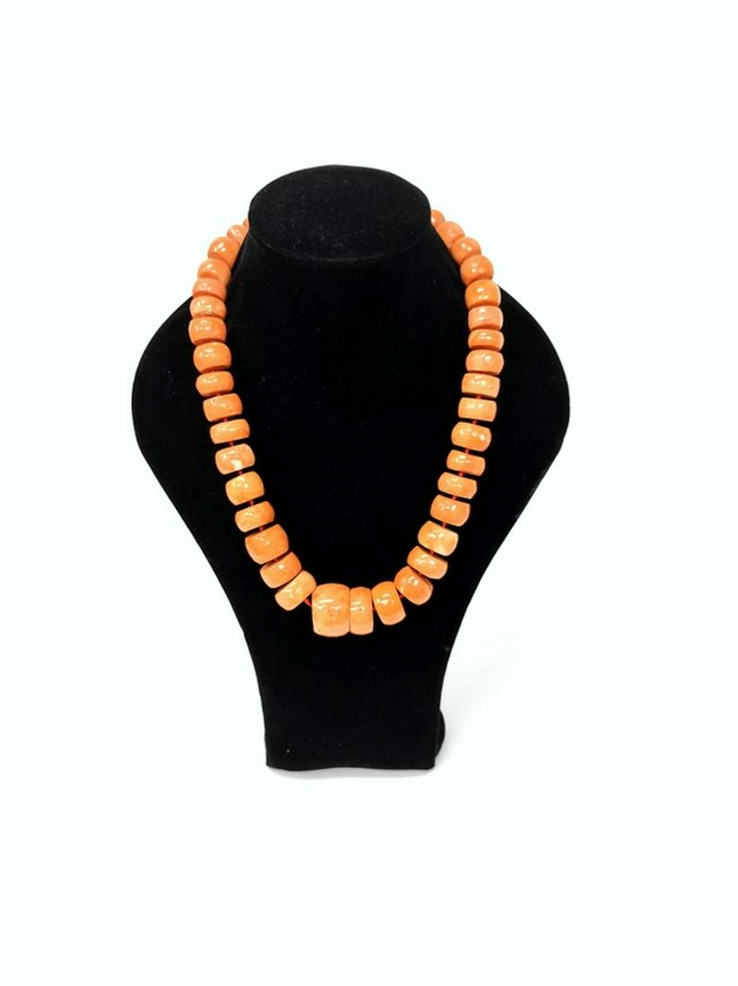 A coral necklace in gradient sizes (1 of 3)