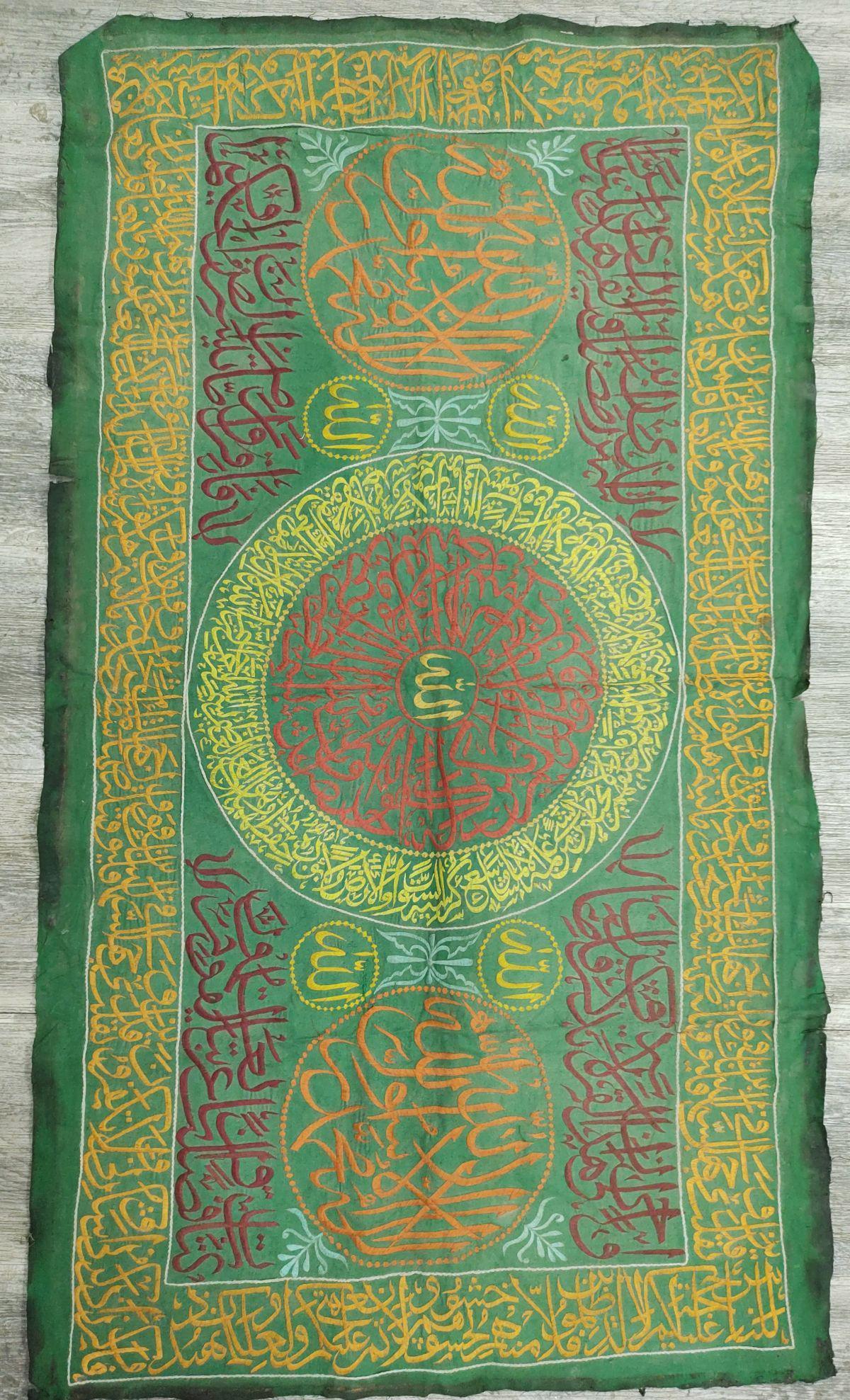 Important and high-quality Islamic fabric, 19th century: The embroidery is tastefully decorated with silk threads in a variety of organic shades, patterned with Islamic calligraphy of verses from the Koran against a background of bright green fabric, 19th c
