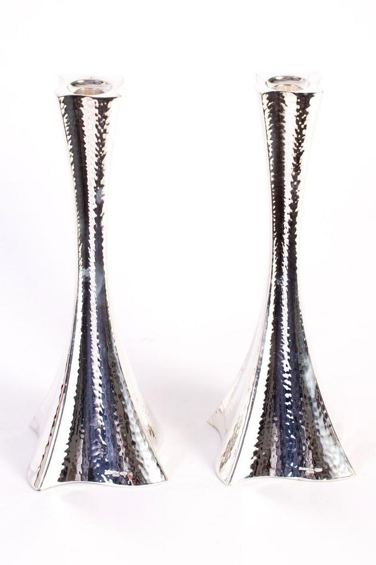 A pair of silver candlesticks set in a modern design (1 of 3)