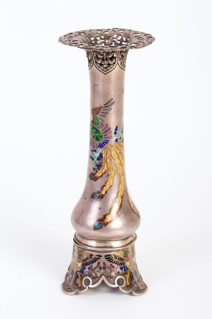 Old Chinese silver Vase Decorated with Enameling: Lovely ornamental vase decorated on its headline with floral sawing, bears artistic enamel decorations depicting a flying Phoenix carrying a flower bouquet. Screwing vase base, also decorated with ope