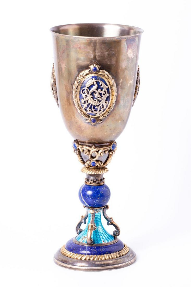 Impressive Silver Goblet Decorated w/ Enamel & Lapis lazuli: Impressive fine (weighted) goblet made of Sterling Silver (marked) and decorated with Lapis lazuli in different formations (orb, halo, Cabochon and plaques), as well as with light blue colored Guilloc