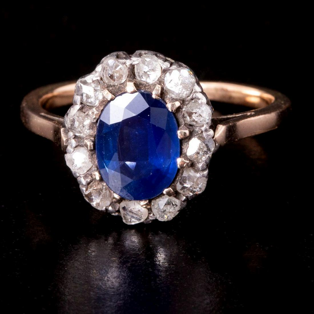 Edwardian 14K Gold Ring Set w/ Natural Sapphire & Rose Cut Diamonds: Lovely Edwardian ring, from beginning of 20th century, made of 14K Gold (marked) integrated with silver (only the upper part) and set with an oval Sapphire with a rich shade weighing approximately 2 C