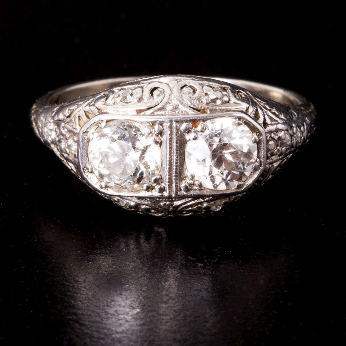 18K White Gold Art-Deco Ring Set w/ 2 Central Diamonds: Art-Deco ring made of 18K White Gold (acid tested), set with two Old European Cut central diamonds weighing a total of approximately 1.2 Carats (0.6 Carats each) and with additional diamonds weighing 