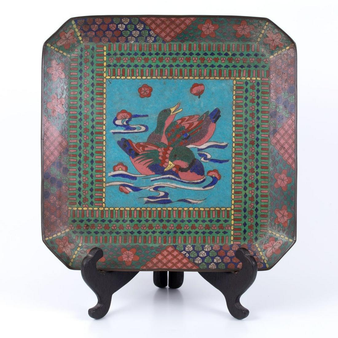 the multicolored tray depicts two ducks frolicking in water that is dispersed with lilies. (1 of 2)