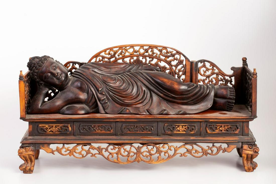 Reposed Buddha - Old Carved Chinese Figurine: Old Chinese figurine carved in the figure of a reposed Buddha. The figurine is situated on a matching lovely base. Flaw and repair to the base's left part. Height: 23 cm Dimensions: 13X45 cm