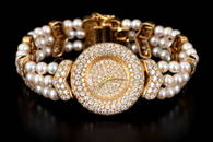 An 18K Gold, Pearl and Diamond watch  Signed boucheron