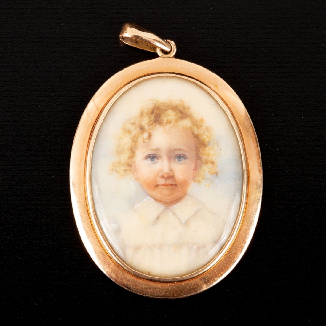 Victorian 14K Gold and Portrait Pendant: a finely crafted 4 x 3 cm pendant with locket containing one finely hand painted portrait of a young child. The painting is of superb quality and detail. The locket pendant is accompanied by an antiqu