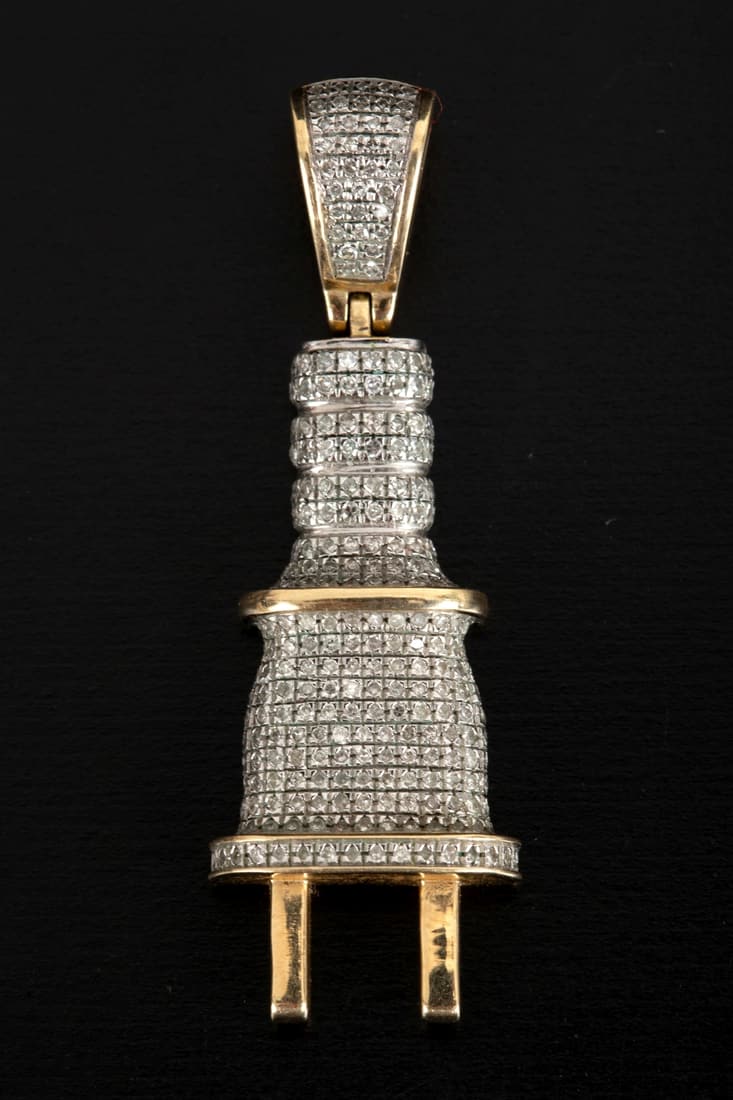 Small 10 karat gold pendant, adorned with small diamonds. (1 of 2)