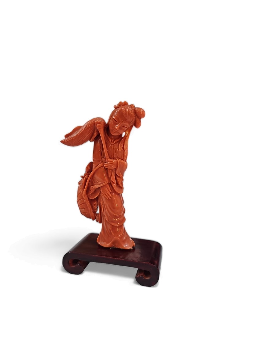 A high-quality Chinese coral figurine in the form of a woman holding a broom (1 of 7)
