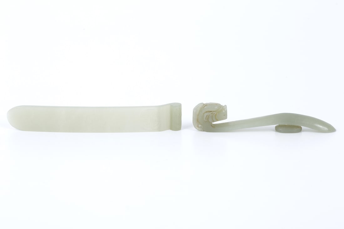 Carved Jade Hair Pin & Belt Buckle-Xing Dynasty: carved jade hair pin with some carved details on the tip. The belt buckle has a dragon head motif carved into it. Chinese from qing dynasty 1644-1912. Hair Pin-120x18 mm Belt Buckle-95x12 mm