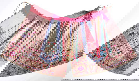 Embroidered Chinese skirt: A traditional Chinese skirt cover, combined with many ribbons over three central pieces, all embroidered with typical motifs of calligraphy, peacocks and organic patterns Dimensions: 92-120 cm Mino