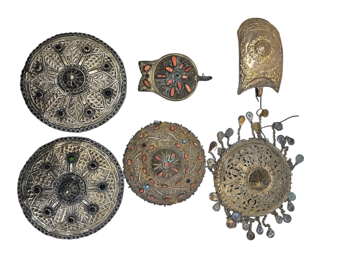 Collection of Ottoman Buckle Pieces: An assemblage that includes Ottoman parts of buckles (two of them matching), Made of sawn/sawed brass handmade by an artist in a floral pattern and some are inlaid with glass and coral. They were prob