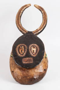 old African Tribal Mask.: Wooden African tribal figurine adorned with carvings and engravings, representing a mythical tribal figure with horns. Painted in vibrant colors. Dimensions: 47-20 cm.