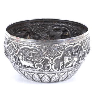 Silver embroidered decorative bowl Gift of Dr Maung Maung and the Burmese Government to Moshe Dayan,: A substantial silver bowl intricately engraved with ethnic scenes, featuring a dedication to Dr. Maung Maung, a former Burmese Defense Minister and later President. Weight: 449 grams Dimensions: 18