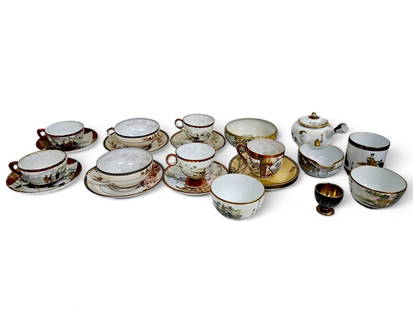 Assortment of Very Large Japanese Porcelain, Satsuma Dish & Kutani Dish: Assortment of different Japanese porcelain dishes, among them: Cup in the Satsuma Ware style decorated with a scene of Otsu-e figures, among them: Okame, Daruma and more. pairs of tea cups and