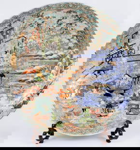 Huge size "imari" plate - 19th century Japan: A large and impressive plate, the inside of the plate depicts a mythological scene against a snowy landscape and a green tree. The edges of the plate on the back side are decorated with repeating