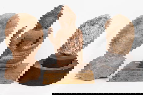 A group of three ancient Buddhas, Cambodia 11-17 centuries: #1 heavy 16th/17th century Cambodian Buddha statue head, carved in stone, bearing traces of gilding Height: 28 cm. Width: 17 cm. #2 Two Early Cambodian Buddhas, 11th/12th century One is