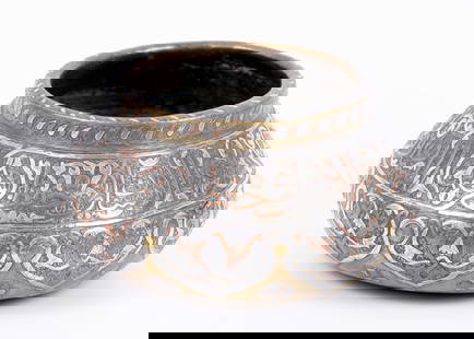 Islamic vase decorated with Damascus work - 19th century: And this is a richly adorned 19th-century Islamic piece with Damascus work - silver filigree and copper inlay in Islamic calligraphy and geometric patterns, as well as intricate and densely engraved