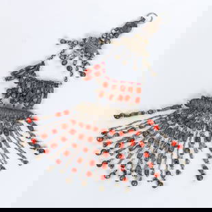 A silver pendant adorned with ethnic coral and a hamsa motif.: A large and impressive ethnic pendant made of silver combined with coral beads, adorned at its center with a hamsa motif. Presumably crafted around 1900. Dimensions: 36x14 cm Total weight: 359