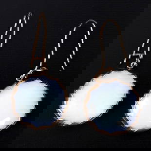 A pair of 9K gold earrings studded with frosted gems: A stylish pair of earrings made of 9 karat rose gold (acid tested), adorned with oval-cut milk white gemstones. The back of the earrings is decorated with elegant engraving. Dimensions