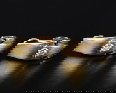 Pair of 18K yellow gold clip earrings with diamonds: A pair of stylish earrings made of 18 carat yellow and white gold (acid tested) and set with two diamonds with a total weight of about 0.2 carats (about 0.1 carats) Have clip closure only.