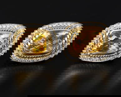 18K gold earrings studded with citrine and diamonds: A pair of stylish earrings made of 18 carat yellow gold (acid tested) Set in the center with rose cut citrine stones surrounded by a halo of diamonds with a total weight of about 0.5 carat.