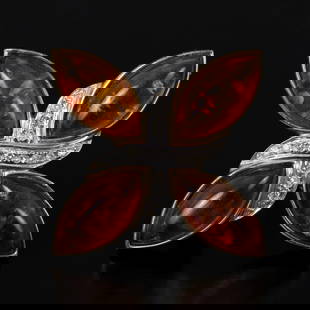 9K gold brooch set with amber and diamonds: Vintage brooch made of 9-carat yellow gold (signed and acid tested) Set with four ambers in a marquise cabochon polish and diamonds in a single-cut polish with a total weight of about 0.15