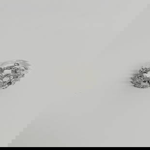 A beautiful white gold ring set with about 75 small diamonds (?): The ring is made in the shape of a crown Dimensions: 6+ Total weight: 5 grams 