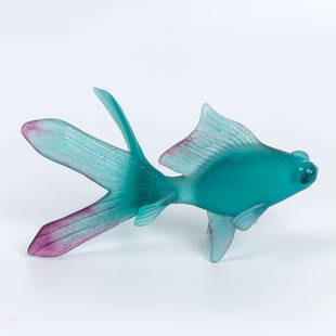 Glass Art Nouveau Figurine by Daum in the shape of a fish.: Impressive and large glass art figurine in the shape of a "Telescope Fish, " signed Daum France. The figurine is made in turquoise color with purple accents. Dimensions: 27-14 cm.