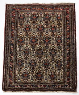 rug in the Mayan style, collected from Persia, early 20th century.: The rug's interior features a pattern of medallions, with a floral motif at the center, while the edges are adorned with multiple frames containing organic and geometric motifs. Dimensions: 150-110