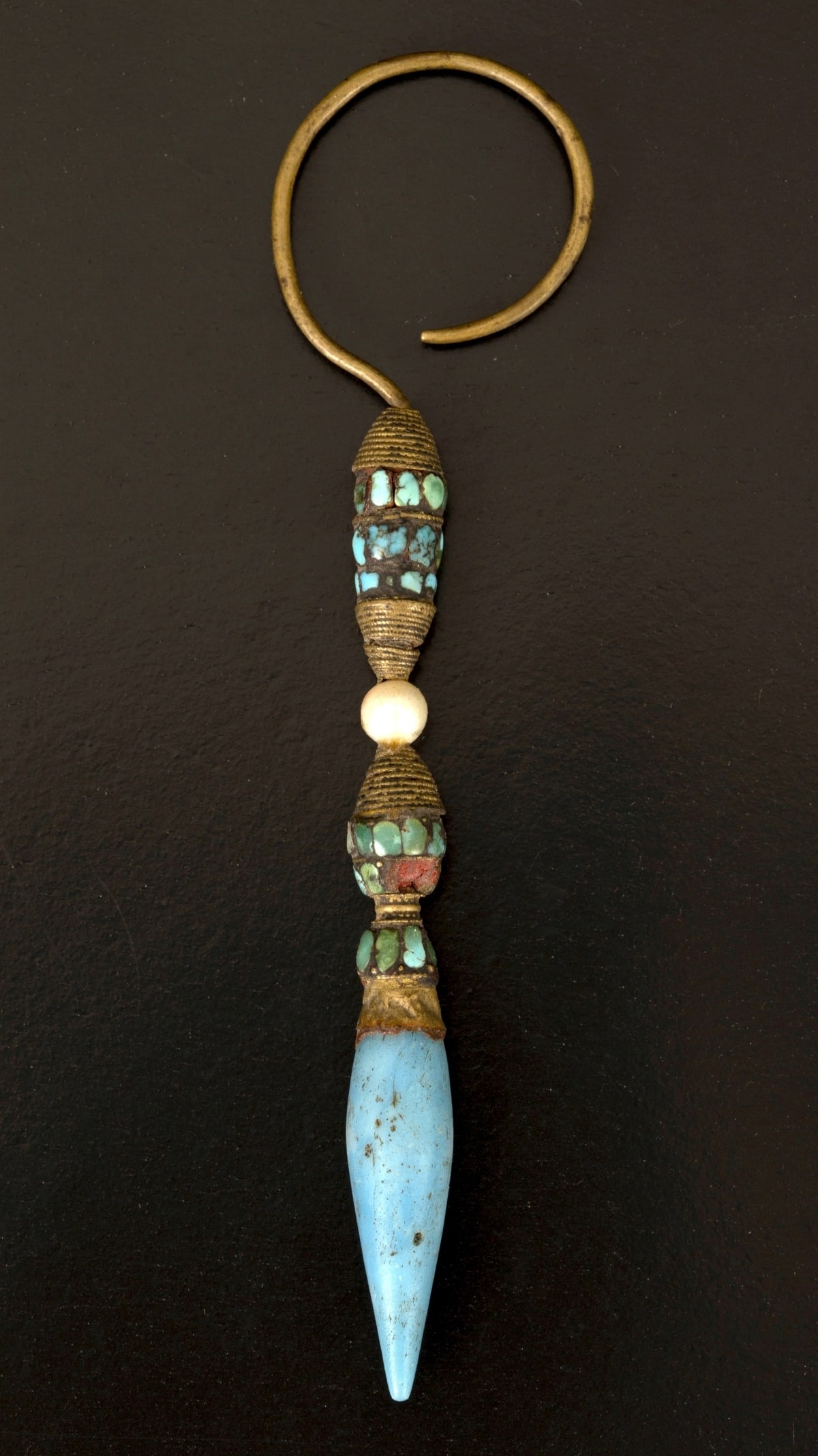 An antique nobleman's earring adorned with gemstones, Tibetan in style. (1 of 4)