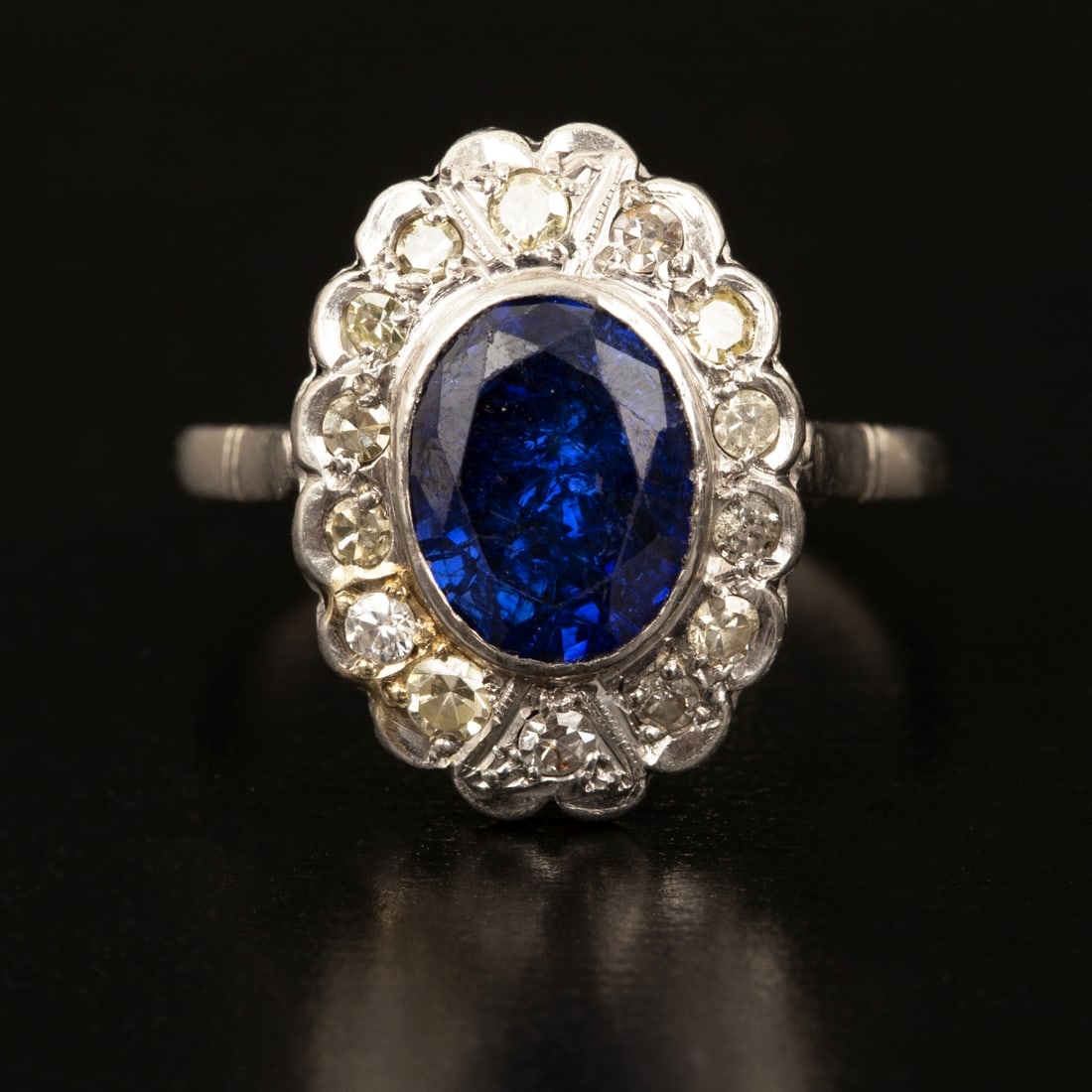 An Antique Platinum Sapphire and Diamond Halo Ring (1 of 4)