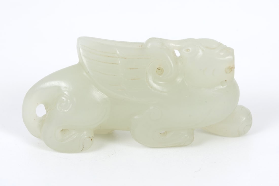 Chinese white jade figurine carved as a winged mythical creature, Ming Dynasty (1 of 3)