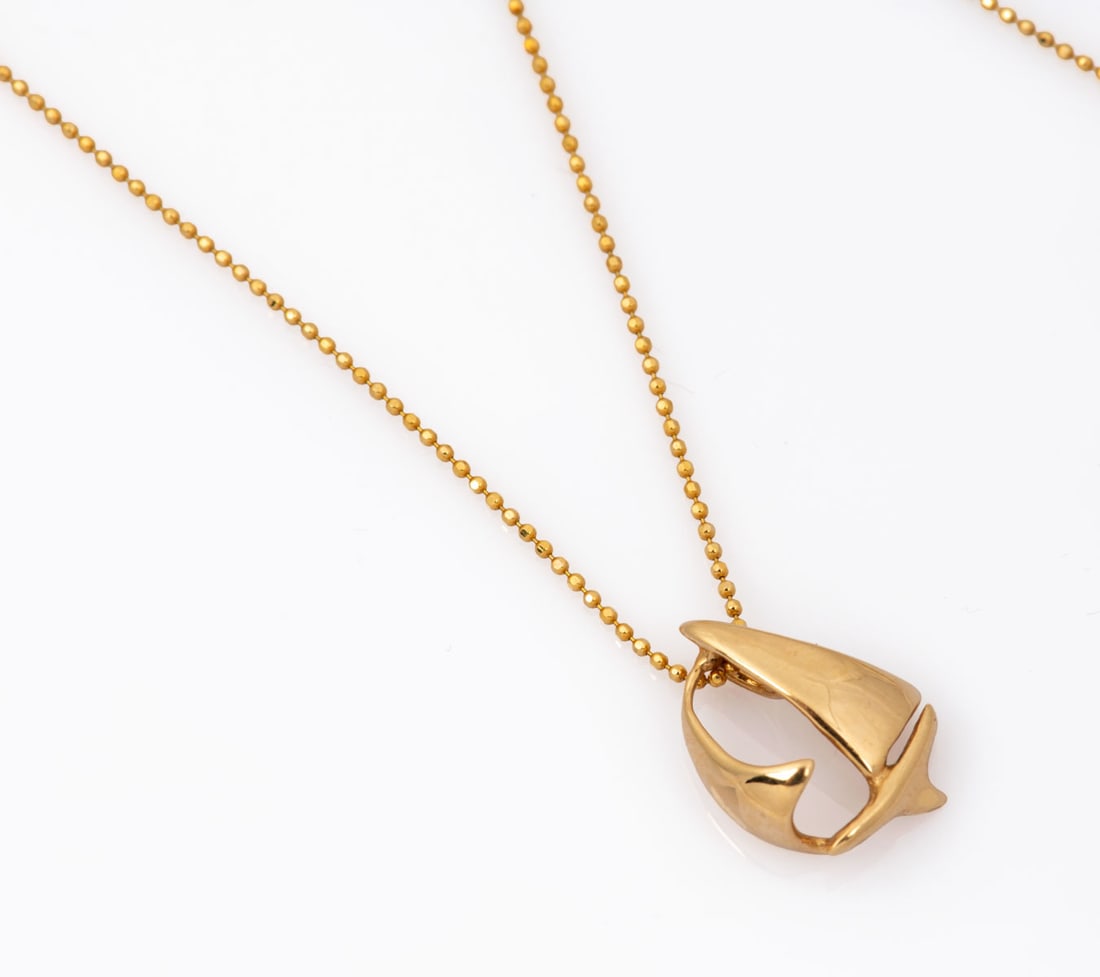 A 14K Gold Pendant Necklace: A 14K Gold Pendant Necklace The pendant designed as sails and suspended from an attractive, gold beaded chain. Fully marked, maker's mark. Total weight: 2.85 gr; size of pendant: 15-17 mm; length of
