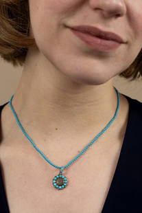 A Georgian 9K Yellow Gold Turquoise and Pearl Mourning Pendant Necklace, England, ca 1835: A Georgian 9K Yellow Gold Turquoise and Pearl Mourning Pendant Necklace, England, ca 1835 The necklace composed of turquoise beads centering a round mourning pendant with braided hair, framed by a hal