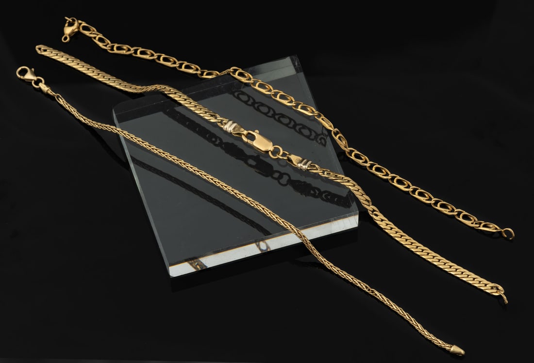 Three 18K Yellow Gold Link Bracelets: Three 18K Yellow Gold Link Bracelets Comprising three dismantled bracelets in assorted link designs. Marked, gold acid tested. Total weight: 11.25?gr; length (each): 18?cm Condition: For a deta