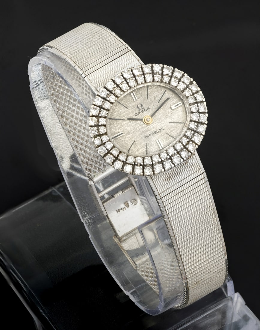 A Vintage Omega 14K White Gold and Diamond Ladies Wristwatch: A Vintage Omega 14K White Gold and Diamond Ladies Wristwatch Movement: Mechanical Case: 14K white gold with twin halo pave-set with diamonds (approx. 1 ct total) Dial: Silver-tone with baton hands