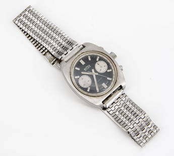 A Butex Stainless Steel Men?s Wristwatch, 1970s: A Butex Stainless Steel Men’s Wristwatch, 1970sMovement: MechanicalComplication: ChronographCase: Stainless steelDial: Black with hour markersBand: Stainless steel link braceletDiameter: 34 mmCondit