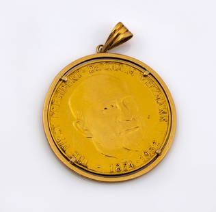 An 18K Yellow Gold Pendant with 900 Gold Medal by Israel Coins and Medals Corp: An 18K Yellow Gold Pendant with 900 Gold Medal by Israel Coins and Medals Corp  Framed in 18K yellow gold, the pendant is set with a gold medal issued by the Israel Coins and Medals Corp in memory of