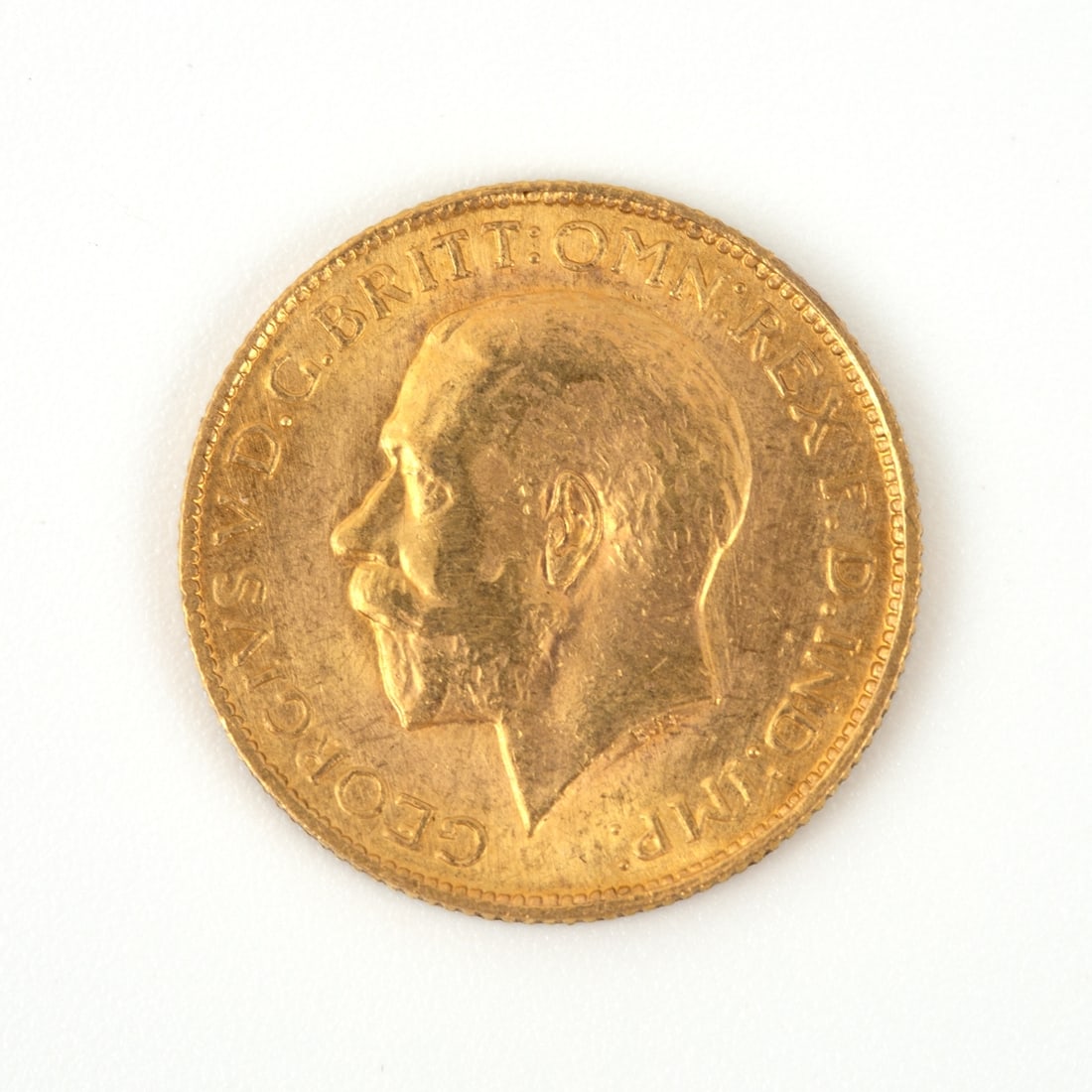 A Royal Mint George V 22K Gold Sovereign Coin, 1919: A Royal Mint George V 22K Gold Sovereign Coin, 1919 Gold: (916.7 fineness) Diameter: 22.05?mm Thickness: 1.52?mm Weight: 7.98?gr Pure gold content: 7.3224?gr