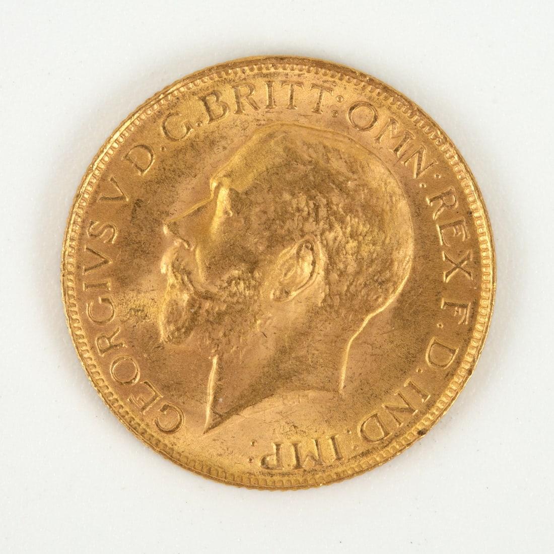 A Royal Mint George V 22K Gold Sovereign Coin, 1927: A Royal Mint George V 22K Gold Sovereign Coin, 1927 Gold: (916.7 fineness) Diameter: 22.05?mm Thickness: 1.52?mm Weight: 7.98?gr Pure gold content: 7.3224?gr