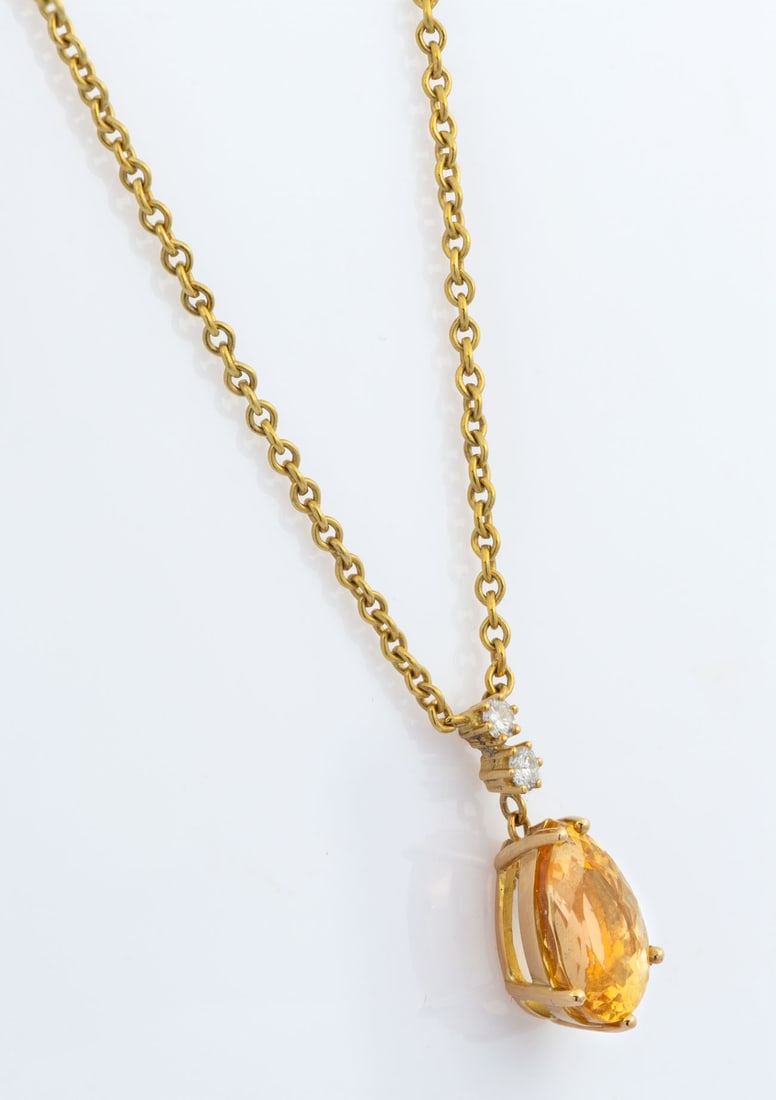An H. Stern 18K Gold Citrine and Diamond Pendant Necklace: The pendant set with a drop-shaped citrine surmounted by two diamonds (approx. 0.07 Ct in total). Signed and acid tested. The pendant (including the diamond surmount) measures approx. 22 x 9.5 mm; tot
