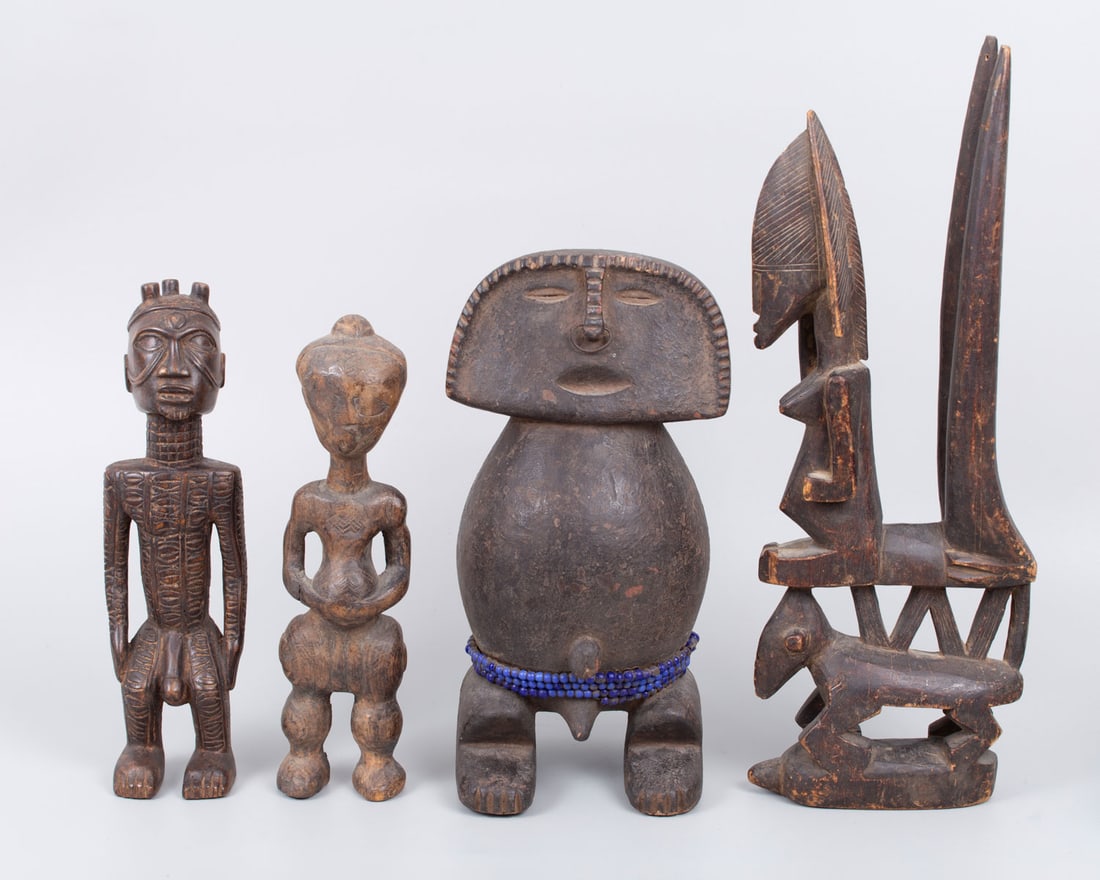 A Mixed Lot of Carved Wood African Figurines, firast half of 20th Century: A Mixed Lot of Carved Wood African Figurines, firast half of 20th Century Comprising: (1) a protective figure adorned with blue glass beads and a metal nose ornament, height: 32 cm; (2) a carved