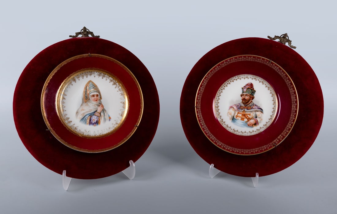 A Pair of Porcelain Presentation Plates, Kuznetsov, Latvia, 19th Century: A Pair of Porcelain Presentation Plates, Kuznetsov, Latvia, 19th Century Each plate centered with painted portraits of noble figures, the deep red borders enriched with gilt highlights. The plates ar