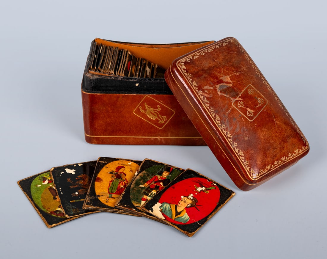 An Old Memory Game in a Fine Leather Case, Italy: An Old Memory Game in a Fine Leather Case, Italy A vintage memory game composed of illustrated playing tiles, housed in a decorated leather box with gilt tooling. hand made Height: 6.5 cm; Wid