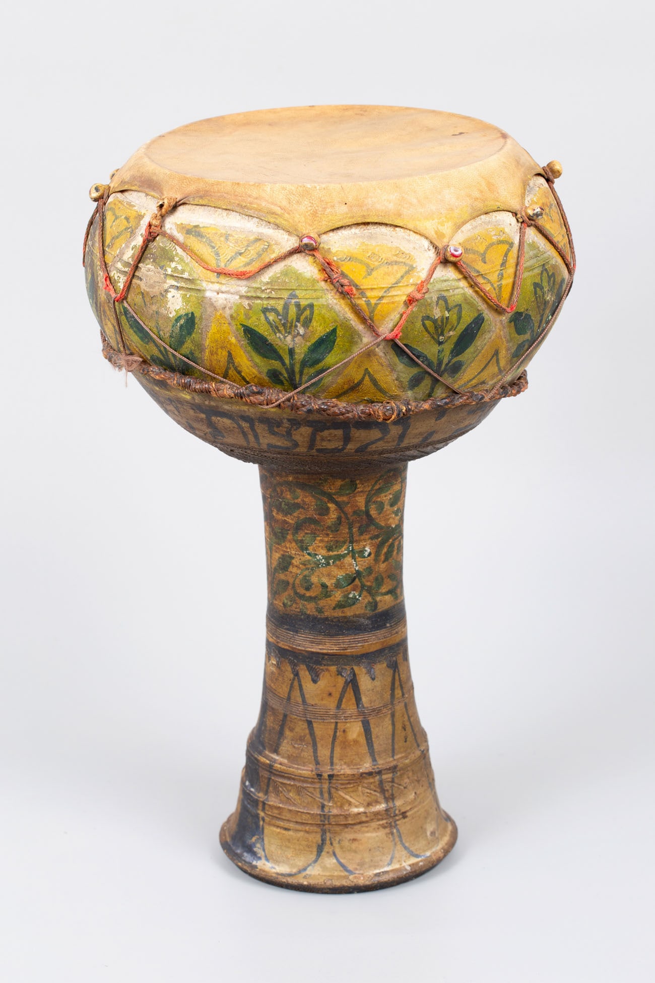 A Painted Terracotta Side Drum (Darbuka), Tunisian Diaspora, Late 19thâ€“Early 20th Century: A Painted Terracotta Side Drum (Darbuka), Tunisian Diaspora, Late 19thâ€“Early 20th Century Crafted of fired terracotta with decorative incisions of scrolling foliage and vegetal motifs, inclu