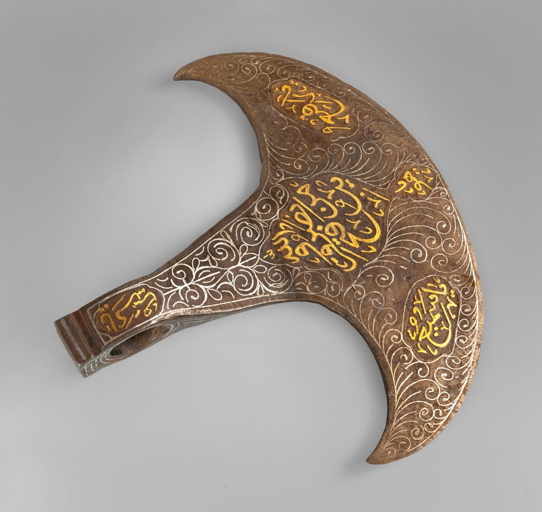 An Islamic Gold and Silver-Inlaid Steel Axe Head, 19th Century (1 of 2)