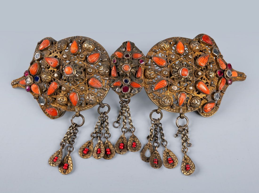 An Ottoman Gilt Copper, Coral and Coloured Glass Belt Buckle, Probably Safranbolu or Trabzon, c.1850: An Ottoman Gilt Copper, Coral and Coloured Glass Belt Buckle, Probably Safranbolu or Trabzon, c.1850 Formed of two interlocking parts, crafted in parcel-gilt copper and decorated with openwork filigr