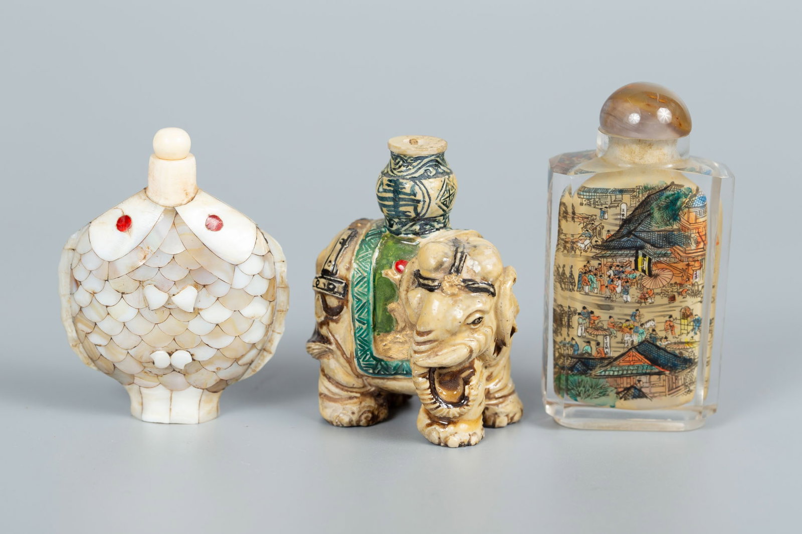 A Mixed Lot of Old Chinese Snuff Bottles: A Mixed Lot of Old Chinese Snuff Bottles Including a bottle in elephant form with polychrome decoration; a fish-form bottle incorporating mother-of-pearl and red enamel; and an inside-painted glass bo